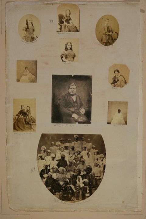 Page of a book. Of ten black and white photographs, seven are portraits of individuals, two show pairs of people, and the one at the bottom a group of about forty people. The photographs are rectangular, oval, octagonal, or arched. The centre photograph is of a man. Most of the rest are of women and children. Below, the group portrait shows darker-skinned people wearing turbans or caps.